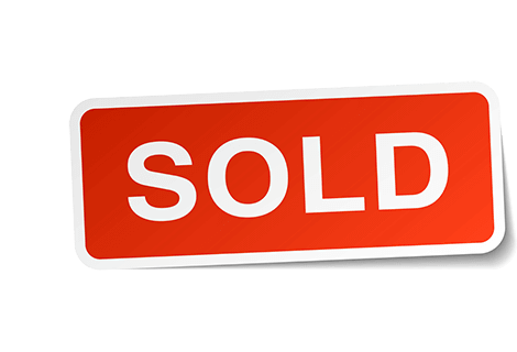 Red sold sign for using a bridging loan for house purchase