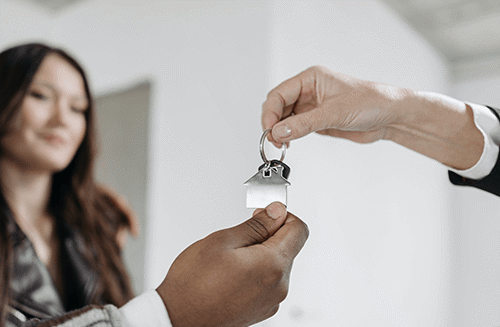 hands with housing keys